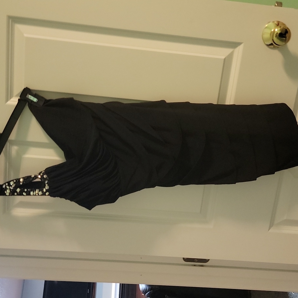 Tight black one shoulder mini dress